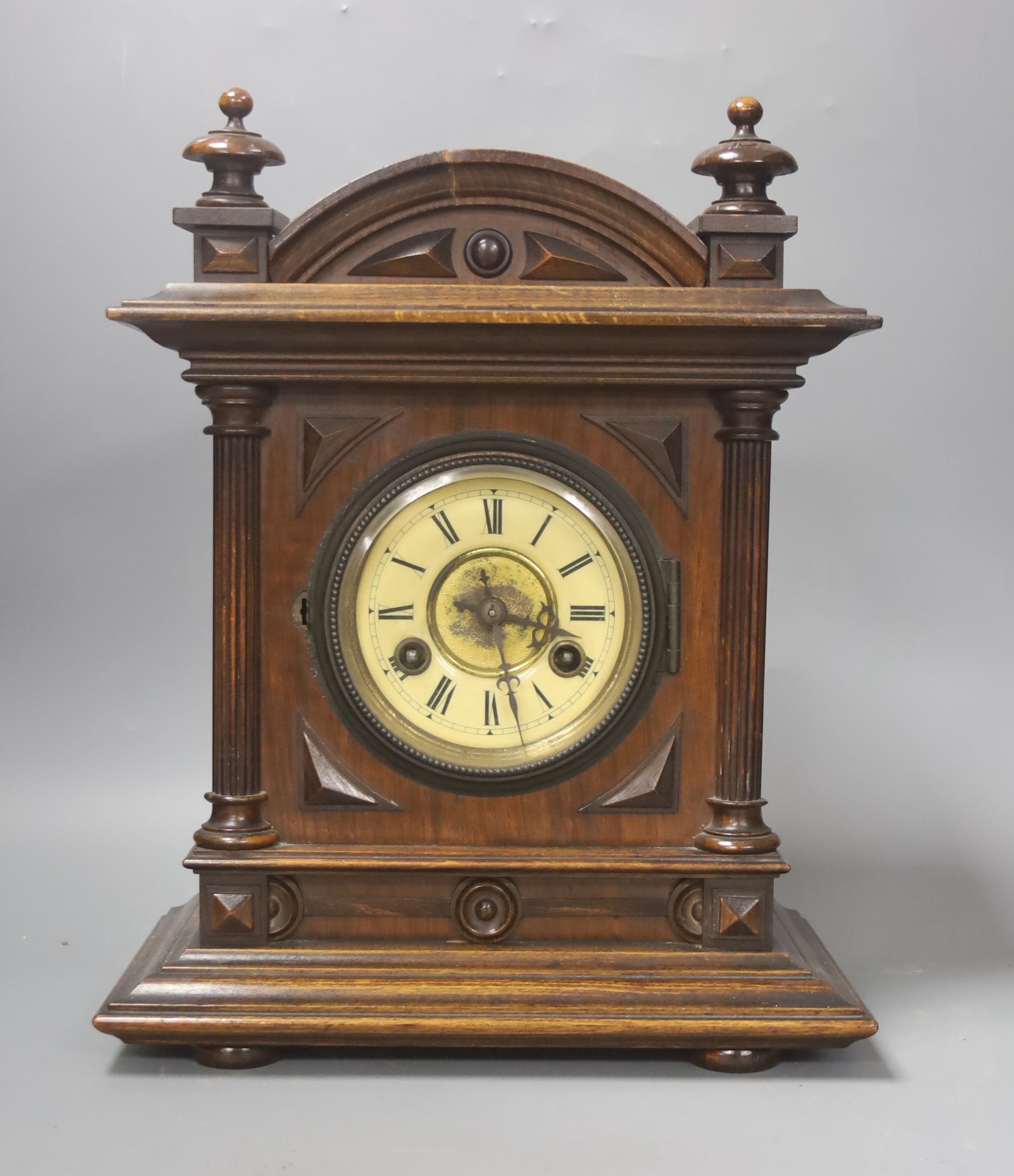 A Late 19th century German walnut mantel clock, 34cm